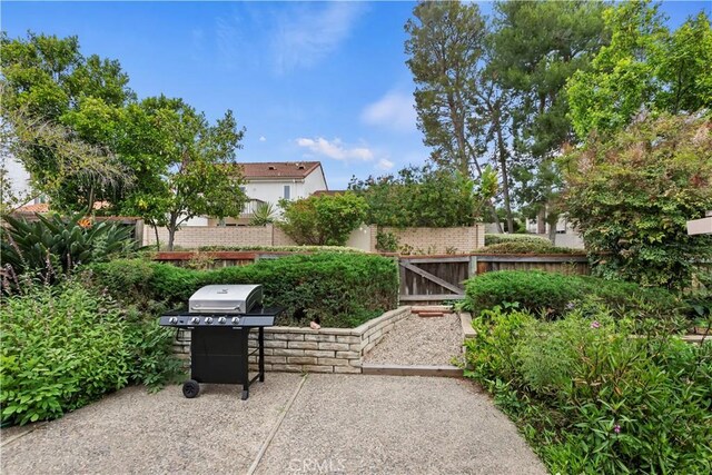 10 Mann St, Irvine, CA 92612 - view of patio featuring a grill and a gate