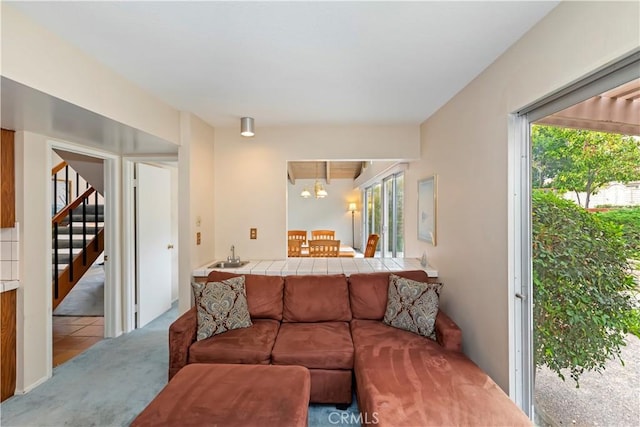 10 Mann St, Irvine, CA 92612 - carpeted living room featuring plenty of natural light and stairway