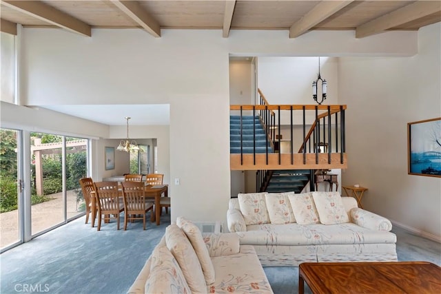 10 Mann St, Irvine, CA 92612 - living room featuring a chandelier, carpet flooring, beamed ceiling, and stairs