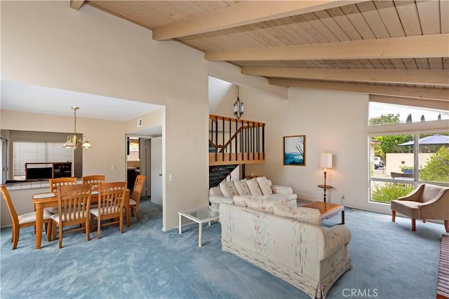 10 Mann St, Irvine, CA 92612 - carpeted living room with a chandelier, a wood ceiling with exposed beams, stairway, and high vaulted ceiling