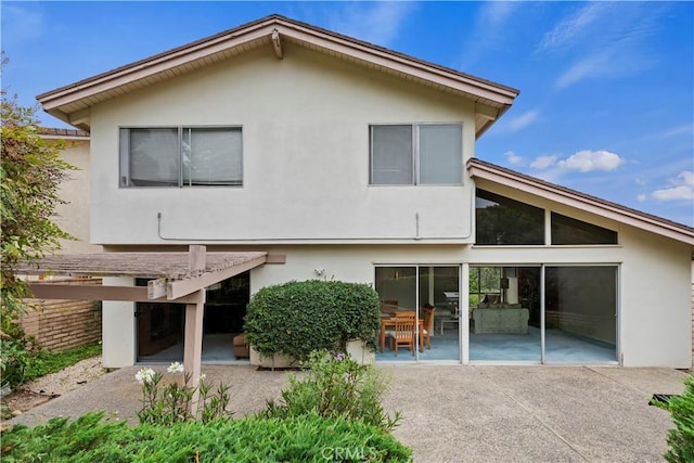 10 Mann St, Irvine, CA 92612 - back of property with a patio, stucco siding, and a pergola