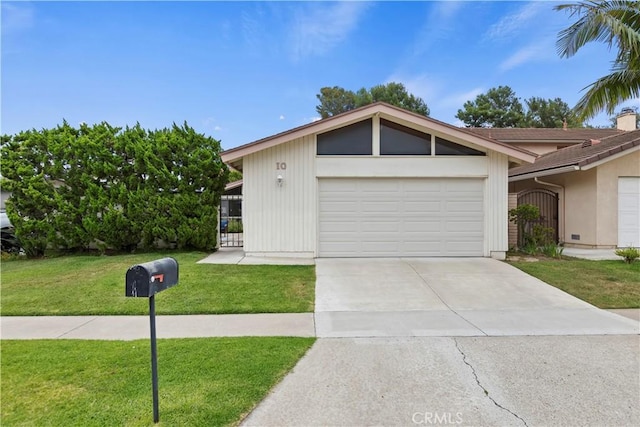 10 Mann St, Irvine, CA 92612 - mid-century inspired home with a garage, a front yard, and driveway