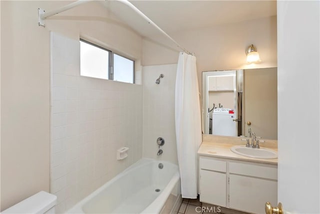 10 Mann St, Irvine, CA 92612 - full bath featuring shower / tub combo with curtain, vanity, and washer / dryer