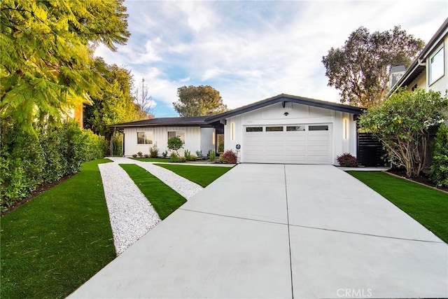19291 Berclair Ln, Tarzana, CA 91356 - ranch-style home featuring a garage, driveway, and board and batten siding