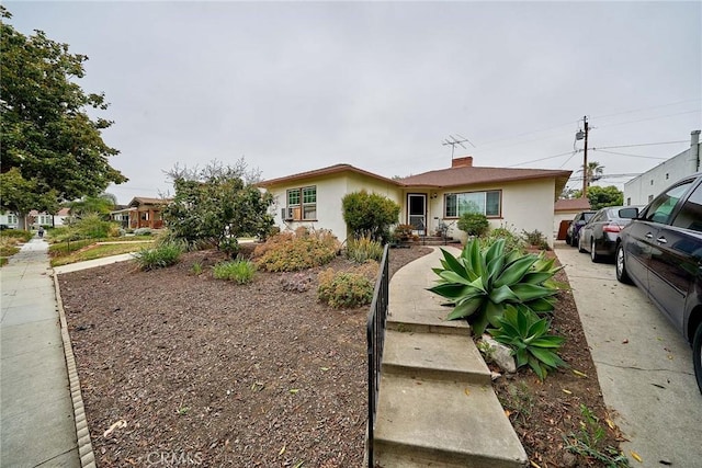 3744 Myrtle Ave, Long Beach, CA 90807 - view of front facade with stucco siding and a chimney