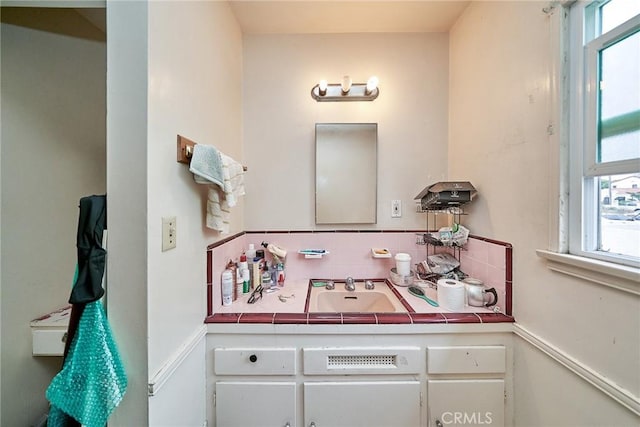 3744 Myrtle Ave, Long Beach, CA 90807 - bathroom with vanity, tasteful backsplash, and plenty of natural light