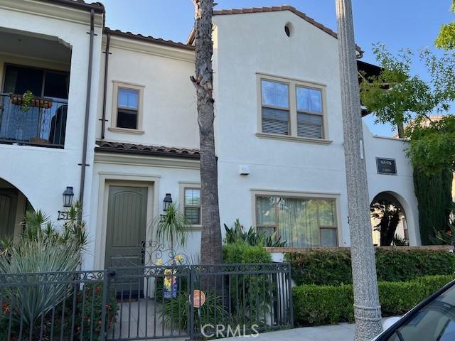 513 E Water St, Anaheim, CA 92805 - view of front facade with stucco siding and a tiled roof