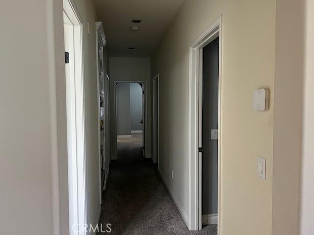 513 E Water St, Anaheim, CA 92805 - hall with dark colored carpet and baseboards