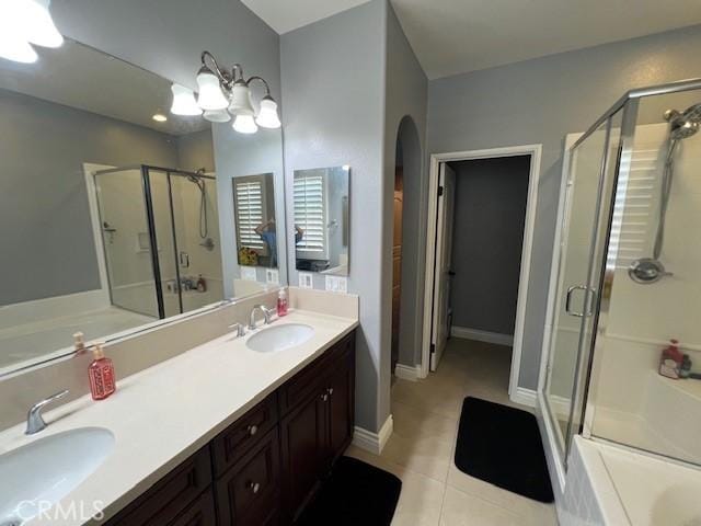 513 E Water St, Anaheim, CA 92805 - bathroom featuring a stall shower, a garden tub, double vanity, and tile patterned flooring
