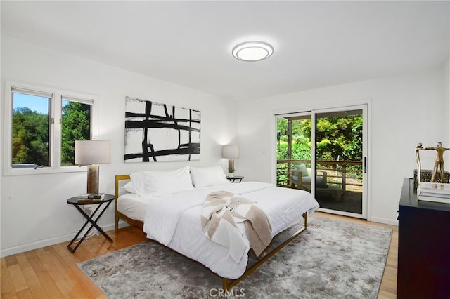 828 Wonder View Dr, Calabasas, CA 91302 - bedroom featuring access to outside and wood finished floors