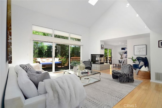 828 Wonder View Dr, Calabasas, CA 91302 - living room with high vaulted ceiling and hardwood / wood-style floors