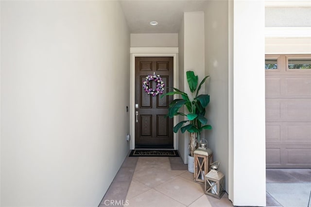 11 Juniper, Lake Forest, CA 92630 - view of exterior entry with stucco siding and a garage