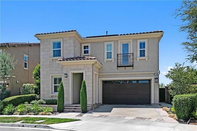 11 Juniper, Lake Forest, CA 92630 - mediterranean / spanish-style house featuring a balcony, driveway, a garage, a tiled roof, and stucco siding