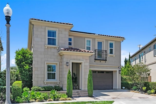 11 Juniper, Lake Forest, CA 92630 - mediterranean / spanish-style home featuring a tile roof, a balcony, a garage, driveway, and stucco siding