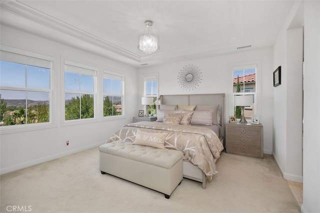 11 Juniper, Lake Forest, CA 92630 - bedroom featuring a tray ceiling, light carpet, a chandelier, and ornamental molding