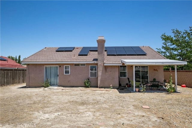 44303 Freer Way, Lancaster, CA 93536 - back of house featuring a fenced backyard, a chimney, a patio, and stucco siding