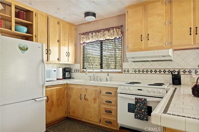 32953 Juniper Ln, Green Valley Lake, CA 92341 - kitchen featuring white appliances, exhaust hood, tile counters, and backsplash