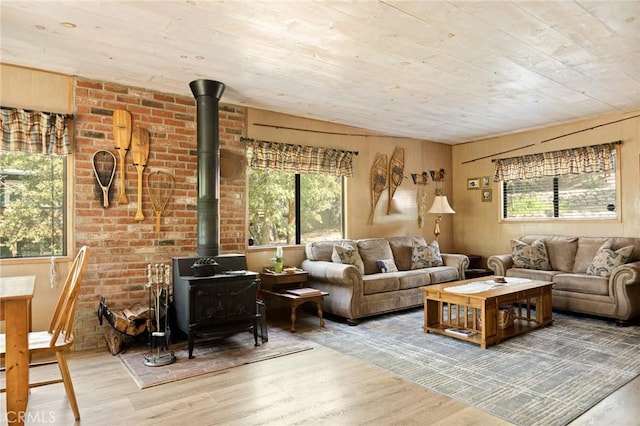 32953 Juniper Ln, Green Valley Lake, CA 92341 - living room with a wood stove, wood finished floors, wooden ceiling, and wooden walls