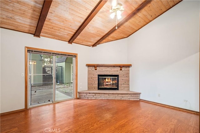 24050 Basin Harbor Ct, Tehachapi, CA 93561 - unfurnished living room featuring a wood ceiling with exposed beams, wood finished floors, ceiling fan, a stone fireplace, and high vaulted ceiling