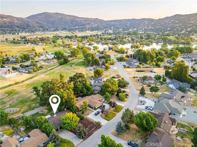 24050 Basin Harbor Ct, Tehachapi, CA 93561 - aerial view at dusk of a residential view and a mountain view