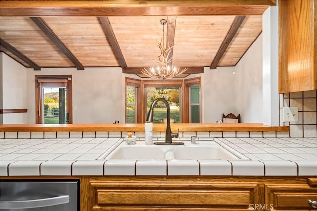 24050 Basin Harbor Ct, Tehachapi, CA 93561 - kitchen featuring wood ceiling, tile counters, stainless steel dishwasher, a chandelier, and brown cabinetry