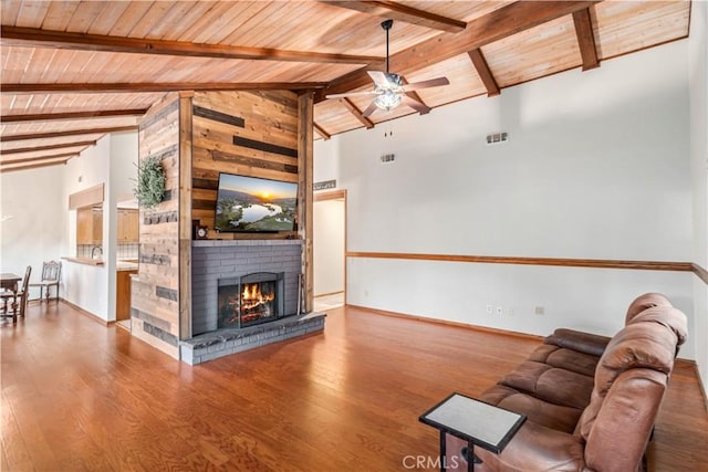 24050 Basin Harbor Ct, Tehachapi, CA 93561 - living area featuring wood ceiling, ceiling fan, wood finished floors, and a fireplace