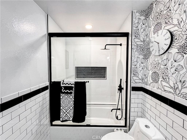 18602 Creek Ln, Huntington Beach, CA 92648 - bathroom featuring tile walls, tub / shower combination, and wainscoting