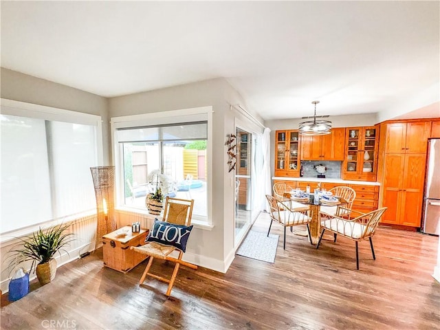 18602 Creek Ln, Huntington Beach, CA 92648 - dining room with light wood finished floors and a chandelier
