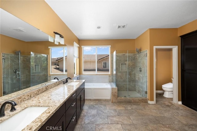 12975 Cambridge Ct, Chino, CA 91710 - full bath with a shower stall, a garden tub, double vanity, and stone finish floors