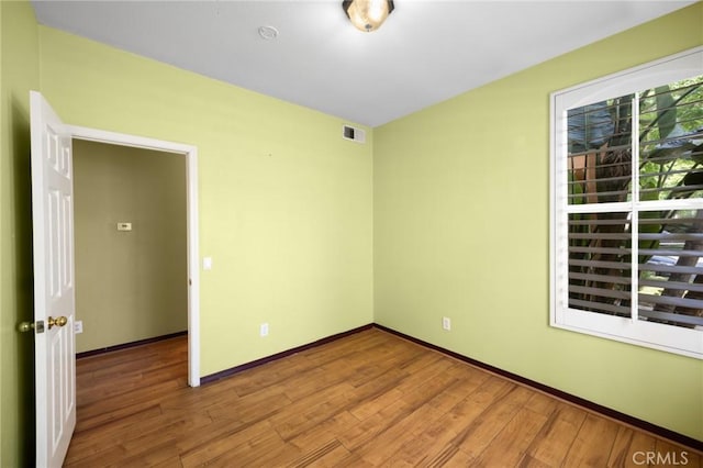12975 Cambridge Ct, Chino, CA 91710 - empty room with wood finished floors and baseboards
