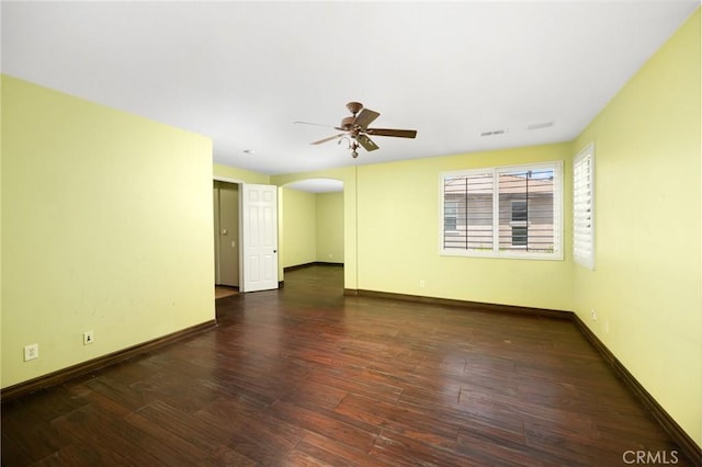 12975 Cambridge Ct, Chino, CA 91710 - spare room featuring arched walkways, ceiling fan, and wood finished floors