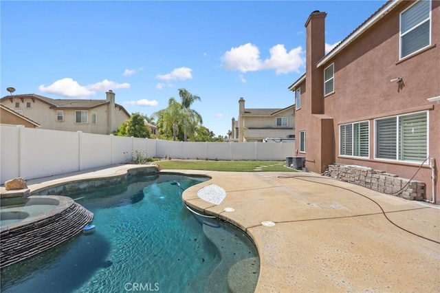 12975 Cambridge Ct, Chino, CA 91710 - view of swimming pool with a fenced backyard, a patio area, and a pool with connected hot tub