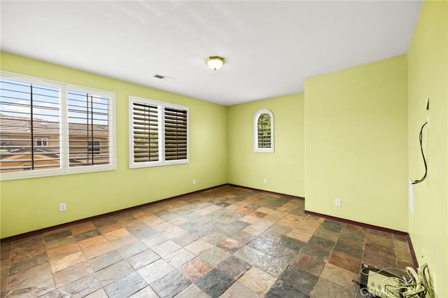 12975 Cambridge Ct, Chino, CA 91710 - unfurnished room featuring baseboards and stone tile floors