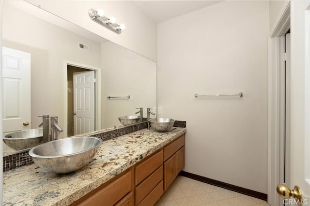12975 Cambridge Ct, Chino, CA 91710 - full bath featuring double vanity and baseboards