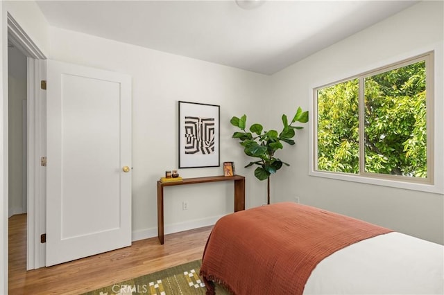 4131 Edgehill Dr, Los Angeles, CA 90008 - bedroom featuring wood finished floors and baseboards