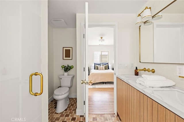4131 Edgehill Dr, Los Angeles, CA 90008 - full bath with connected bathroom, double vanity, brick patterned floors, and a stall shower
