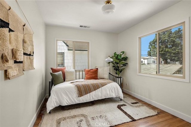 4131 Edgehill Dr, Los Angeles, CA 90008 - bedroom featuring wood finished floors and baseboards