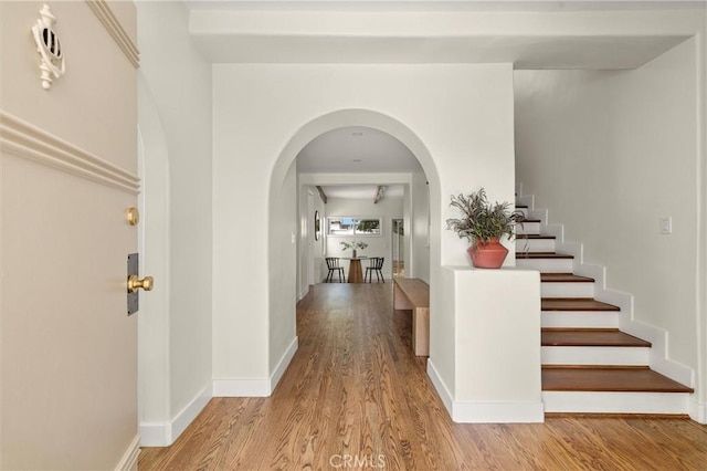 4131 Edgehill Dr, Los Angeles, CA 90008 - foyer with wood finished floors, arched walkways, and stairway