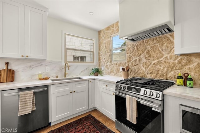 4131 Edgehill Dr, Los Angeles, CA 90008 - kitchen featuring stainless steel appliances, premium range hood, and white cabinets