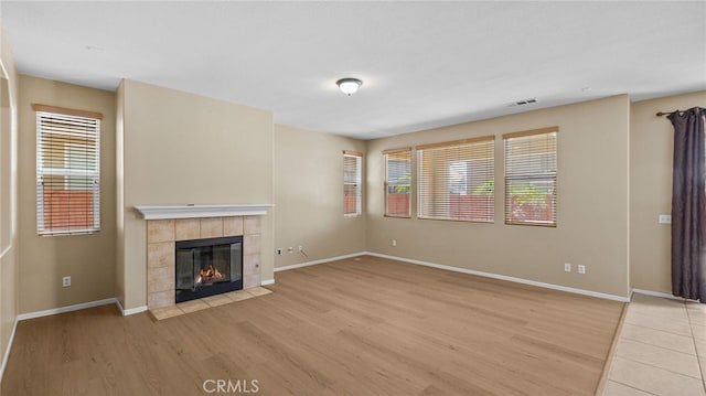 3360 Hammock St, Perris, CA 92571 - unfurnished living room with a fireplace and light wood-style flooring