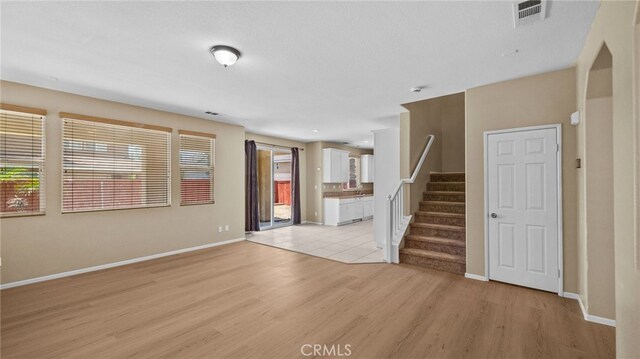 3360 Hammock St, Perris, CA 92571 - unfurnished living room with light wood-type flooring and stairs
