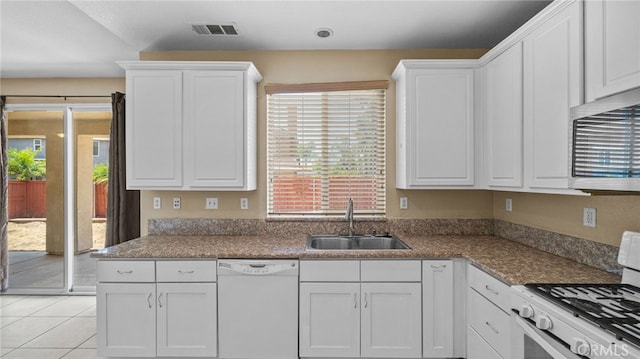 3360 Hammock St, Perris, CA 92571 - kitchen featuring white appliances, white cabinets, and light tile patterned flooring