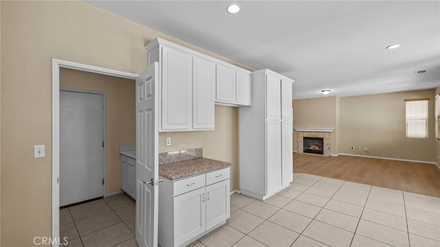 3360 Hammock St, Perris, CA 92571 - kitchen with light tile patterned floors, white cabinetry, and recessed lighting
