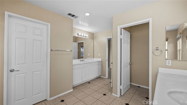 3360 Hammock St, Perris, CA 92571 - full bath featuring two vanities and tile patterned floors