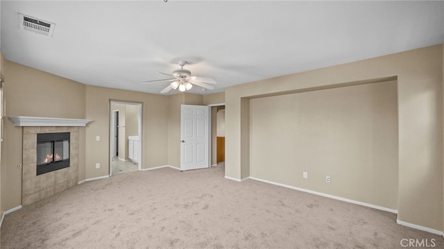 3360 Hammock St, Perris, CA 92571 - unfurnished living room featuring carpet, a tiled fireplace, and ceiling fan