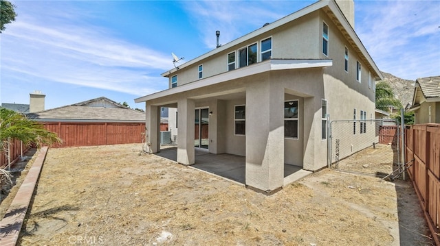 3360 Hammock St, Perris, CA 92571 - rear view of property with stucco siding, a patio area, and a fenced backyard