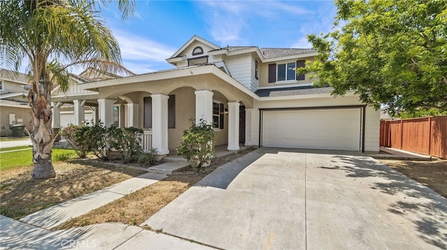 3360 Hammock St, Perris, CA 92571 - view of front of property featuring a porch, a garage, driveway, and stucco siding
