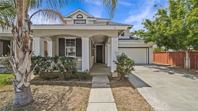 3360 Hammock St, Perris, CA 92571 - view of front of house with an attached garage, a porch, stucco siding, and concrete driveway