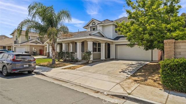 3360 Hammock St, Perris, CA 92571 - view of front of home with driveway, a garage, a porch, and roof with shingles