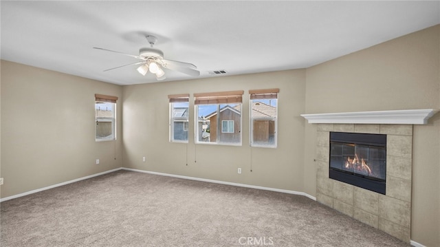 3360 Hammock St, Perris, CA 92571 - unfurnished living room featuring carpet flooring, plenty of natural light, a ceiling fan, and a tiled fireplace
